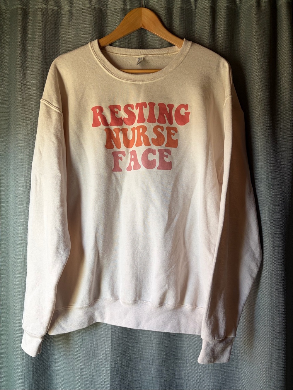 Jerzees Cream Sweatshirt with Pink-Orange 'Resting Nurse Face' Graphic